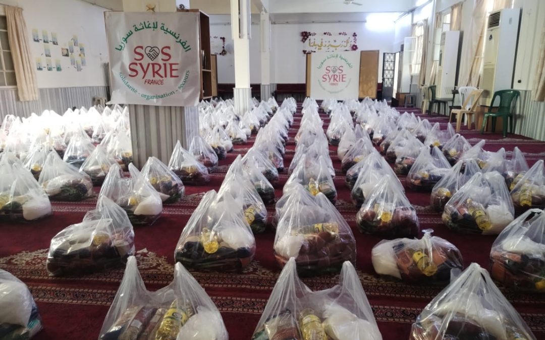 Distribution de colis alimentaires à Damas Masaken Barza
